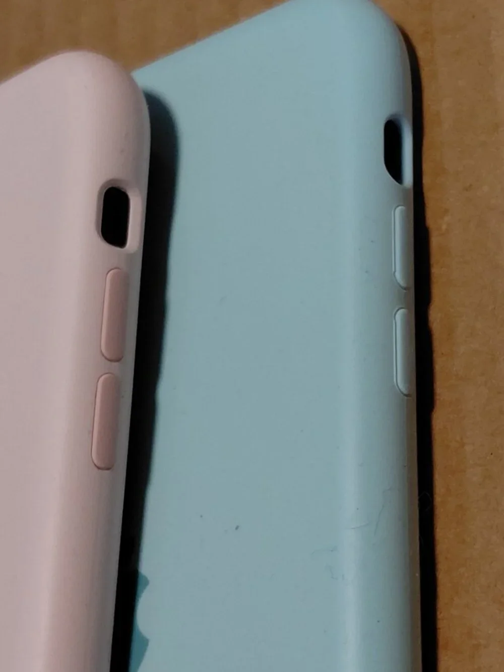 Apple silicone phone cases for the iPhone 11 Pro in light pink and seafoam green